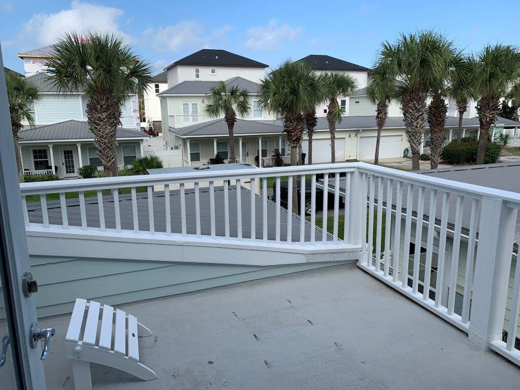 54 Batchelors Button Drive, Unit 9 Miramar Beach, FL 32550 - Photo 22 of 28 a view of a house with a deck and a yard
