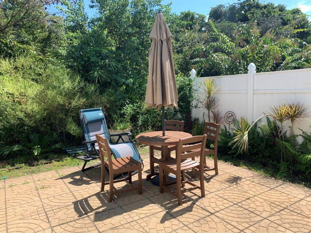 54 Batchelors Button Drive, Unit 9 Miramar Beach, FL 32550 - Photo 23 of 28 a view of a backyard with sitting area and furniture