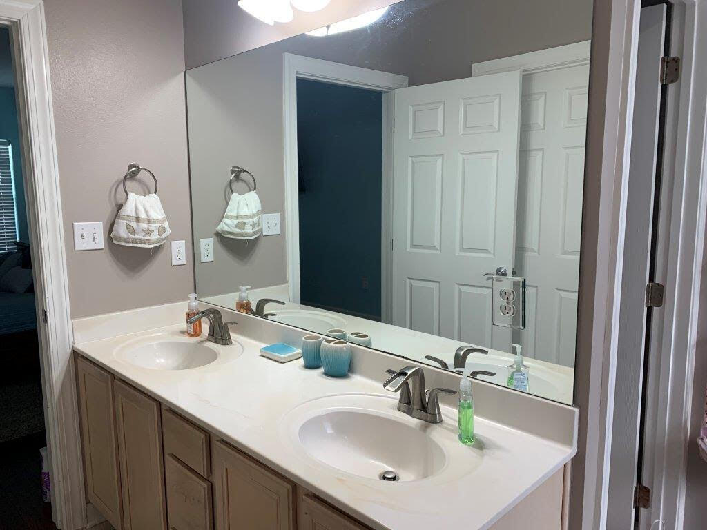 54 Batchelors Button Drive, Unit 9 Miramar Beach, FL 32550 - Photo 26 of 28 a bathroom with a sink and a mirror