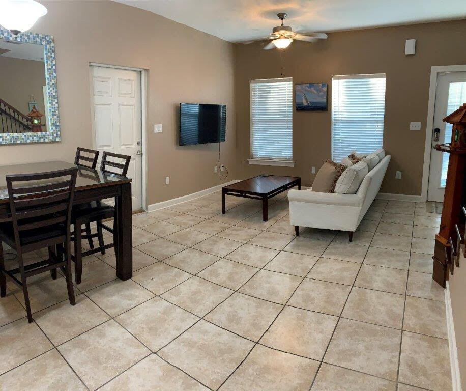 54 Batchelors Button Drive, Unit 9 Miramar Beach, FL 32550 - Photo 28 of 28 a living room with furniture and a flat screen tv