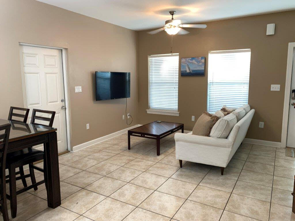 54 Batchelors Button Drive, Unit 9 Miramar Beach, FL 32550 - Photo 3 of 28 a living room with furniture and a flat screen tv