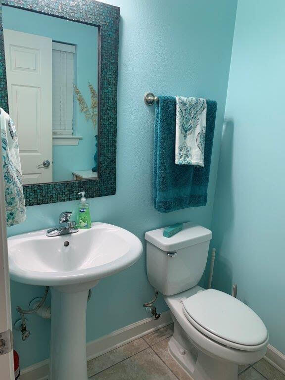 54 Batchelors Button Drive, Unit 9 Miramar Beach, FL 32550 - Photo 7 of 28 a bathroom with a toilet sink and mirror