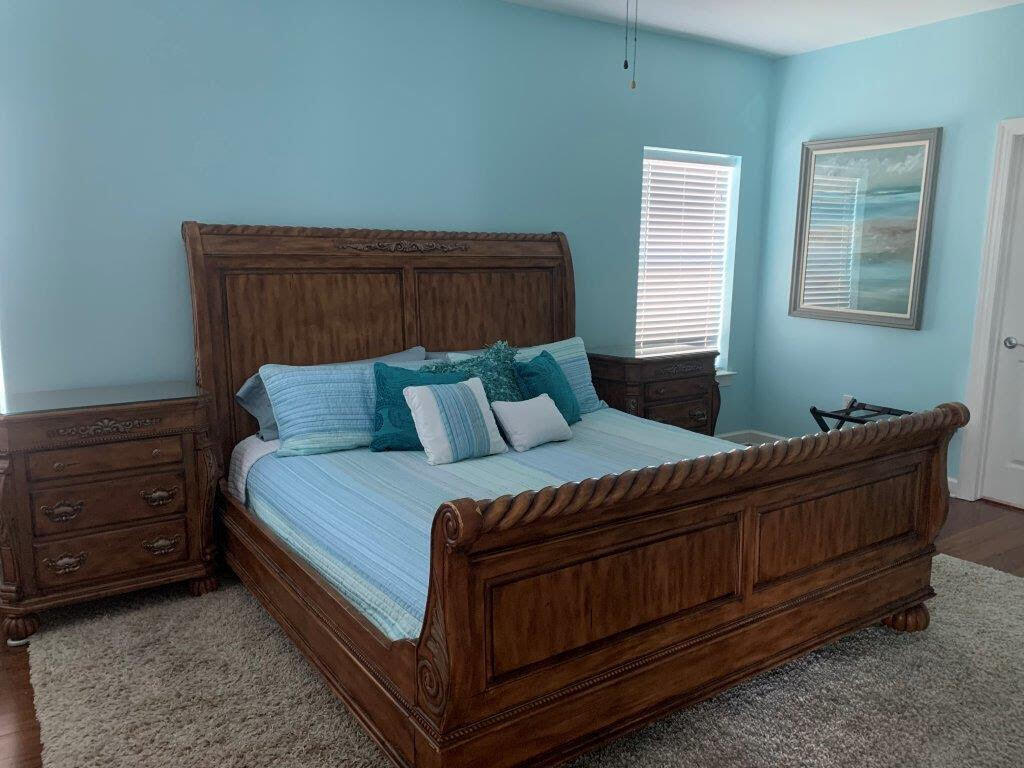 54 Batchelors Button Drive, Unit 9 Miramar Beach, FL 32550 - Photo 8 of 28 a bed sitting in a bedroom next to a window with lamp