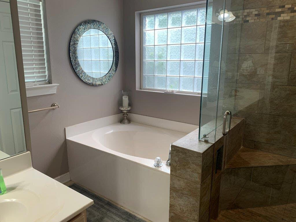 54 Batchelors Button Drive, Unit 9 Miramar Beach, FL 32550 - Photo 10 of 28 a bathroom with a sink and a mirror