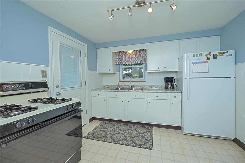 907 Hamil Road Verona, PA 15147 - Photo 13 of 21 a kitchen with a sink stove and refrigerator