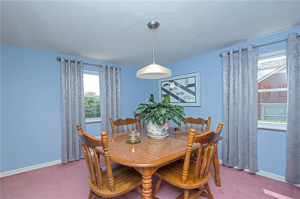 907 Hamil Road Verona, PA 15147 - Photo 16 of 21 a dining room with furniture a window and a chandelier