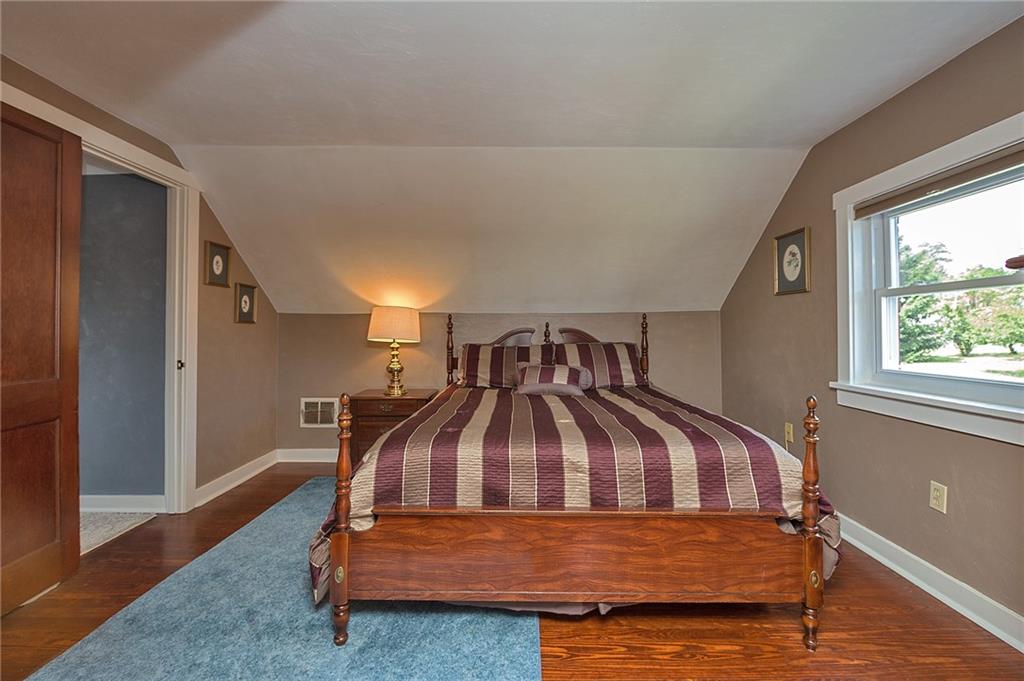 907 Hamil Road Verona, PA 15147 - Photo 19 of 21 a bedroom with a bed and window