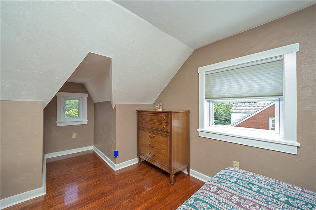 907 Hamil Road Verona, PA 15147 - Photo 21 of 21 a view of an empty room with wooden floor and a window