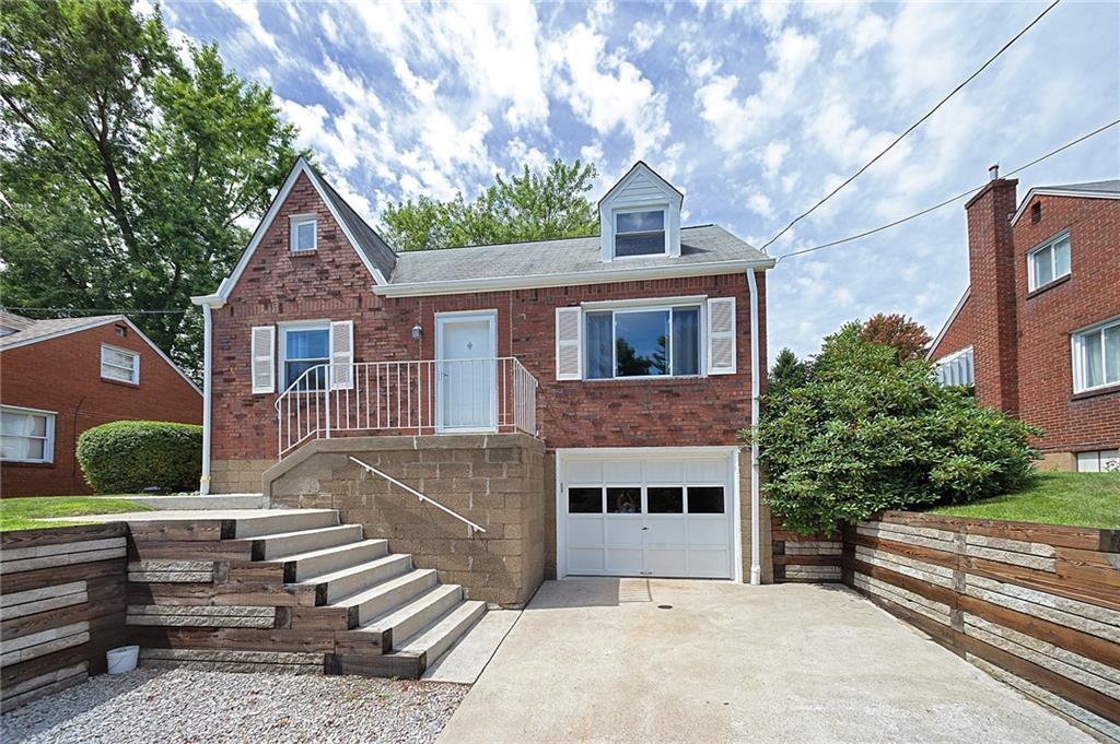 907 Hamil Road Verona, PA 15147 - Photo 3 of 21 a front view of a house with a garden