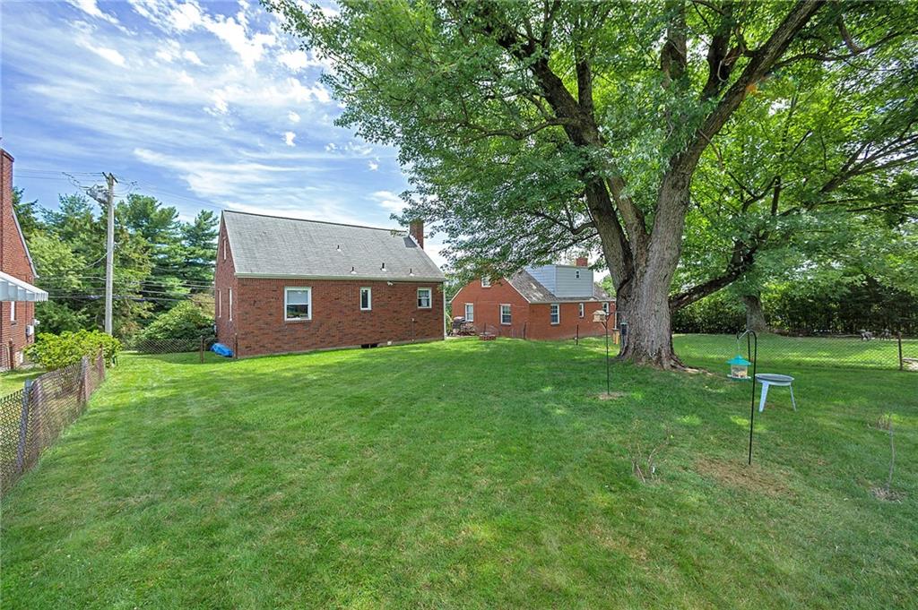 907 Hamil Road Verona, PA 15147 - Photo 6 of 21 a view of a backyard with a garden