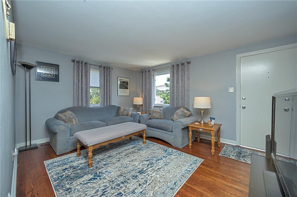 907 Hamil Road Verona, PA 15147 - Photo 7 of 21 a living room with furniture and a rug
