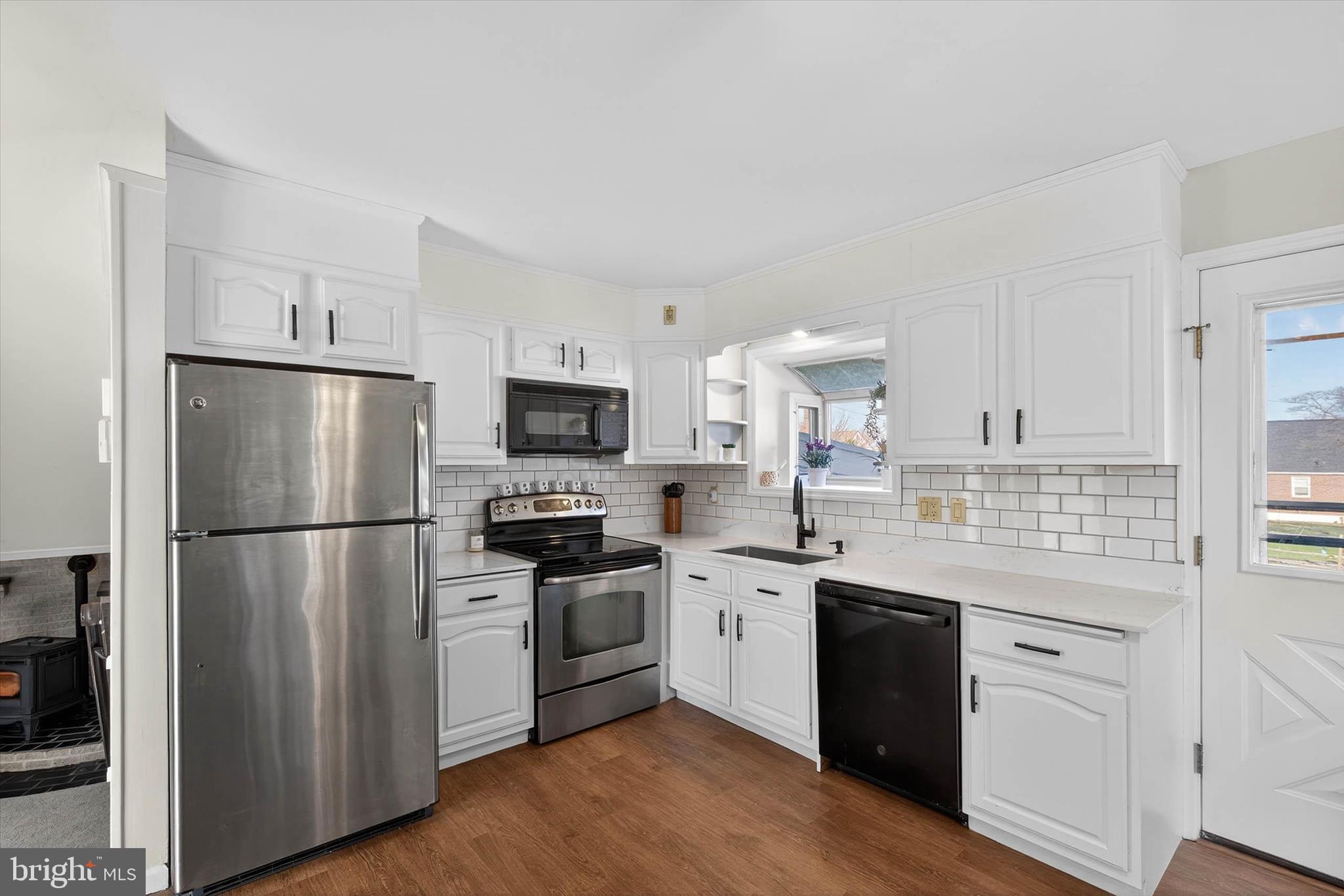 27 Rosemont Avenue Reading, PA 19607 - Photo 10 of 49 a kitchen with a sink white cabinets and stainless steel appliances