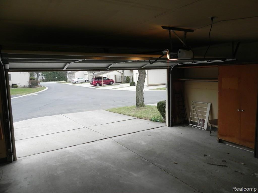 Sought after two car garage w/new garage door and remote opener & tons of storage