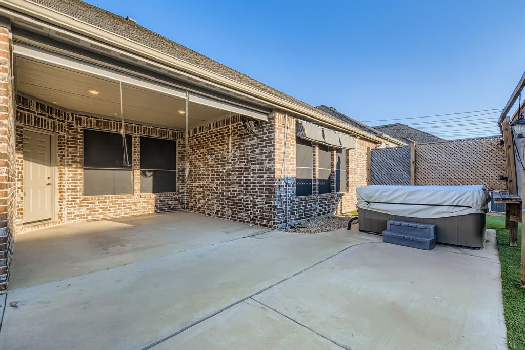 312 Magnolia Drive Oak Point, TX 75068 - Photo 25 of 28 View of patio / terrace with a hot tub