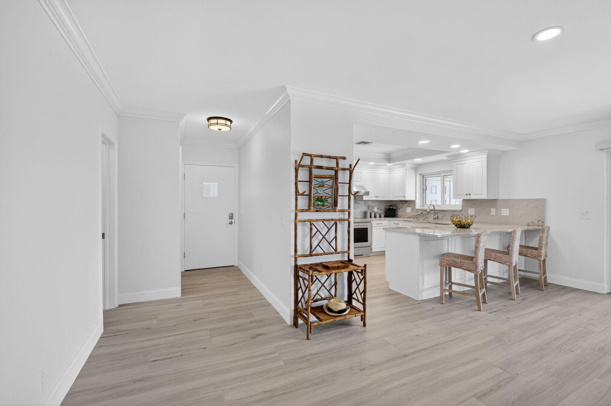 1710 South Ocean Boulevard, Unit 32 Delray Beach, FL 33483 - Photo 12 of 58 a living room with dining room and wooden floor