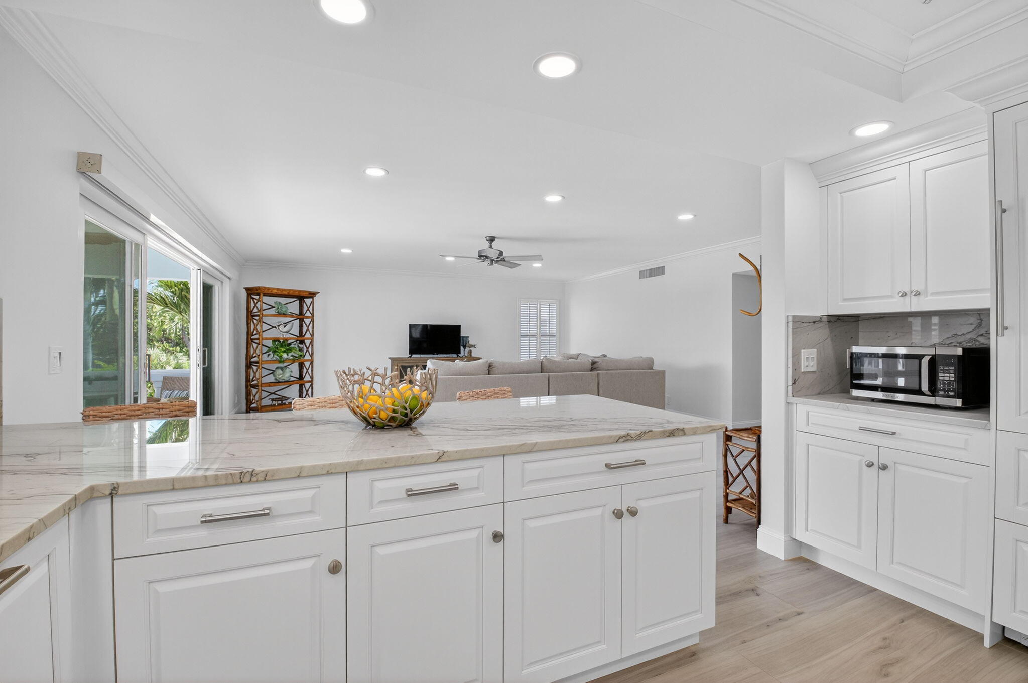 1710 South Ocean Boulevard, Unit 32 Delray Beach, FL 33483 - Photo 19 of 58 a kitchen with a sink and cabinets