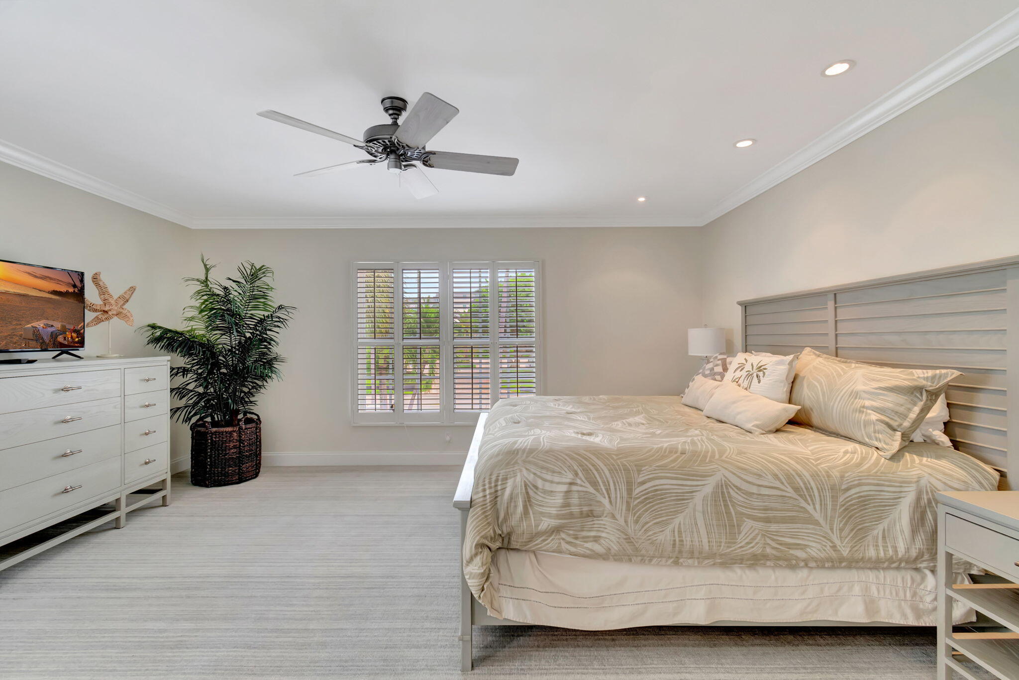 1710 South Ocean Boulevard, Unit 32 Delray Beach, FL 33483 - Photo 21 of 58 a bedroom with a bed and a window