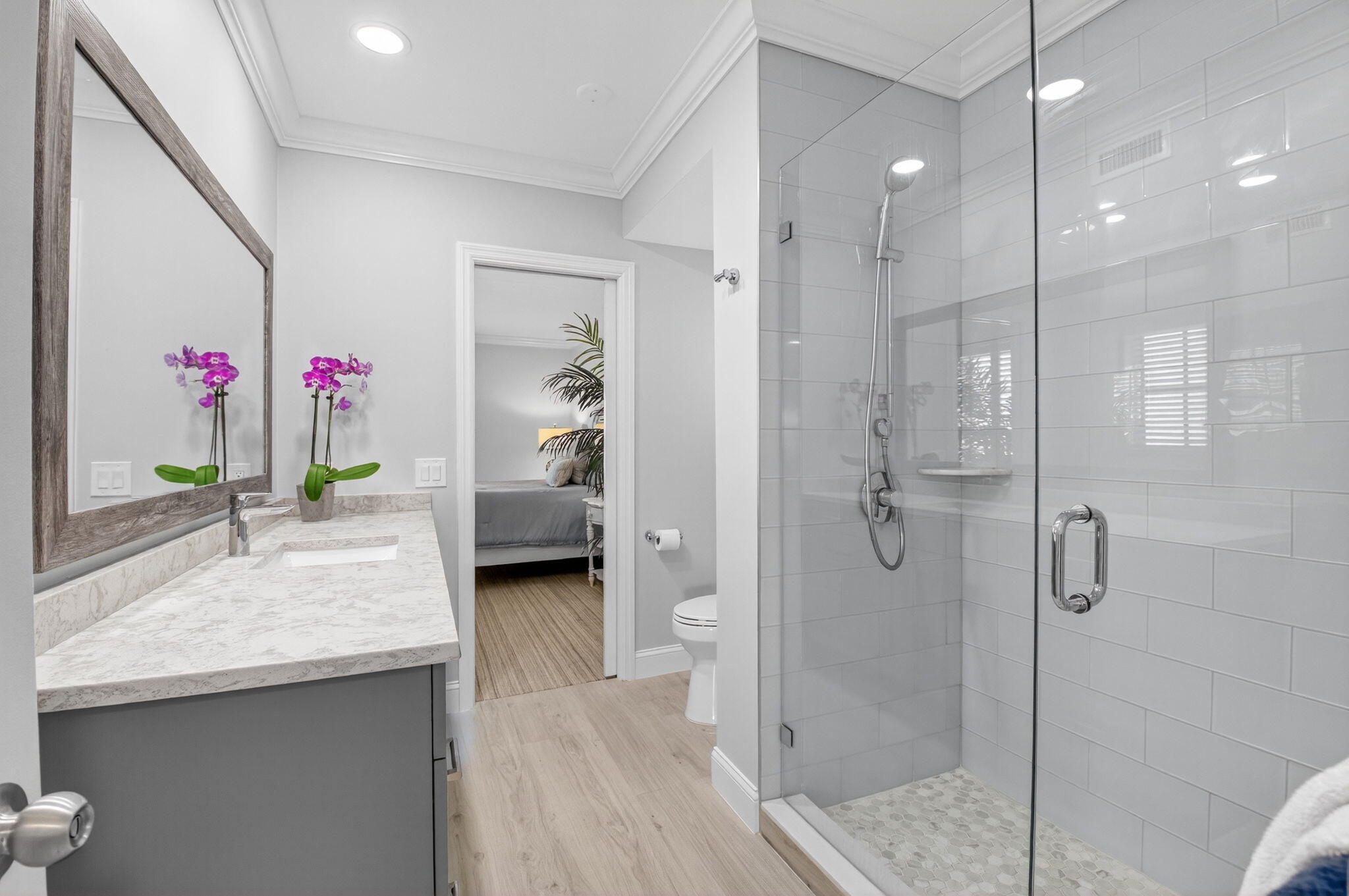 1710 South Ocean Boulevard, Unit 32 Delray Beach, FL 33483 - Photo 32 of 58 a en suite bathroom with a granite countertop sink a toilet and shower