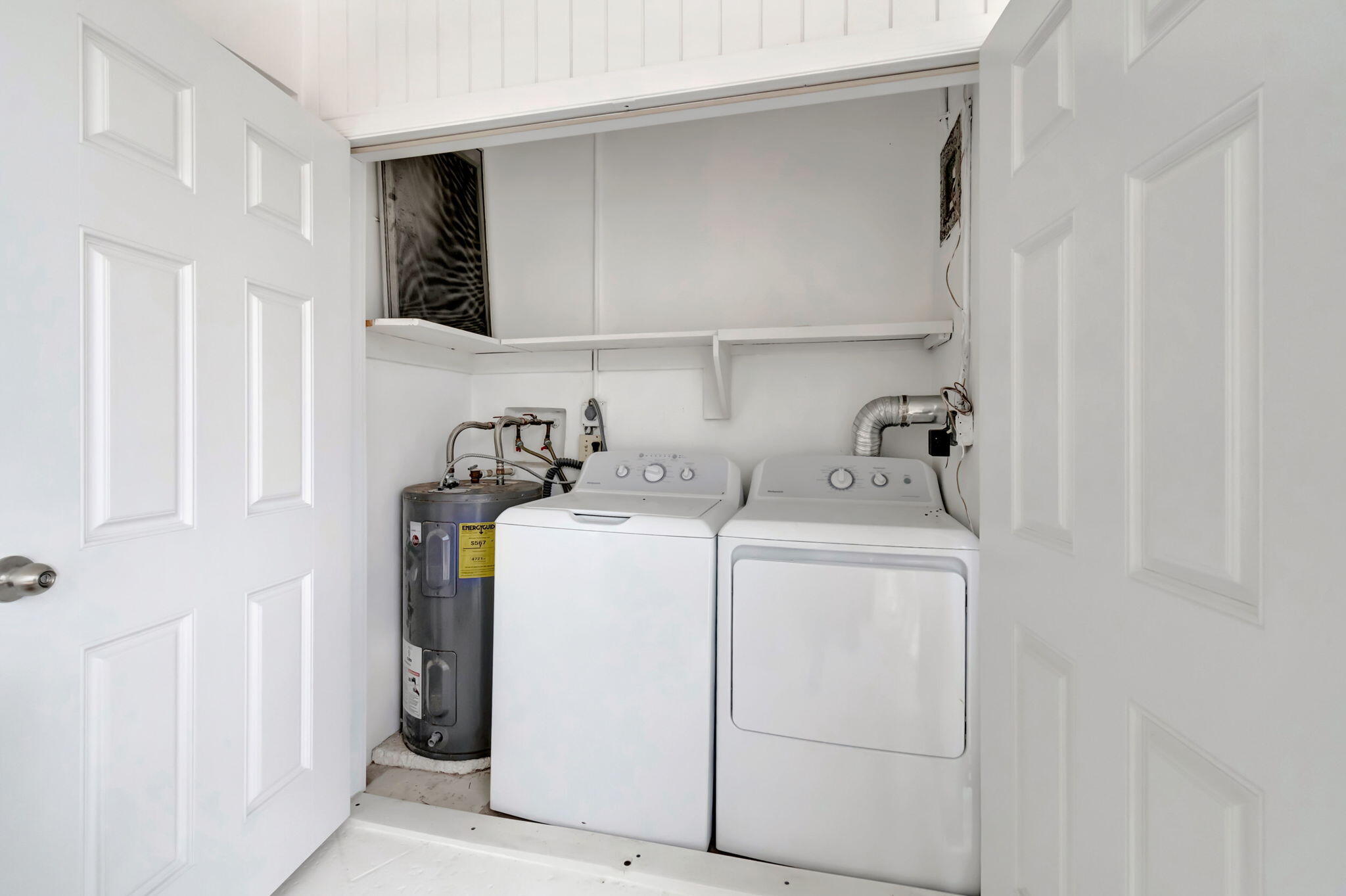 1710 South Ocean Boulevard, Unit 32 Delray Beach, FL 33483 - Photo 34 of 58 a utility room with dryer and washer