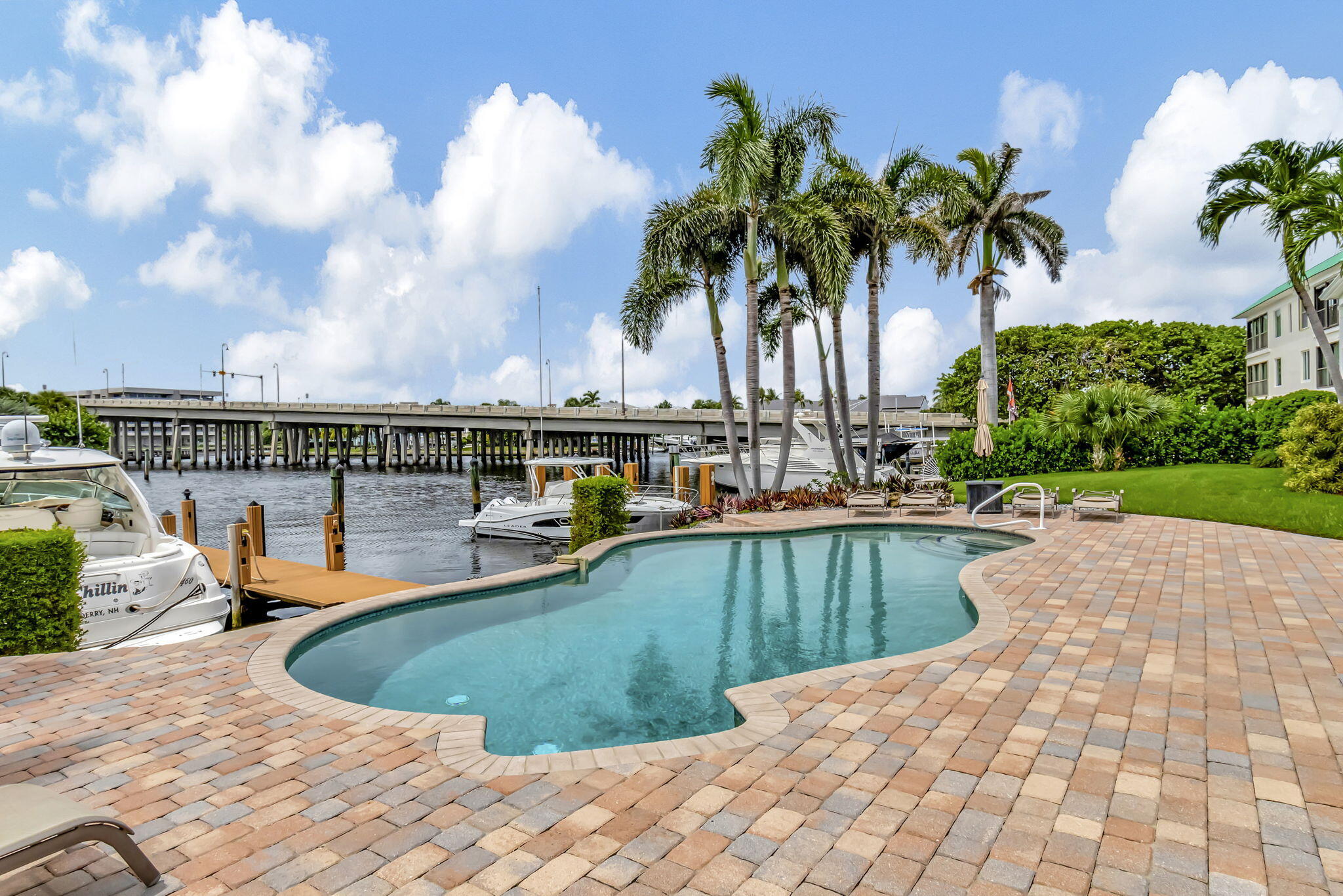 1710 South Ocean Boulevard, Unit 32 Delray Beach, FL 33483 - Photo 37 of 58 a view of a swimming pool with a patio
