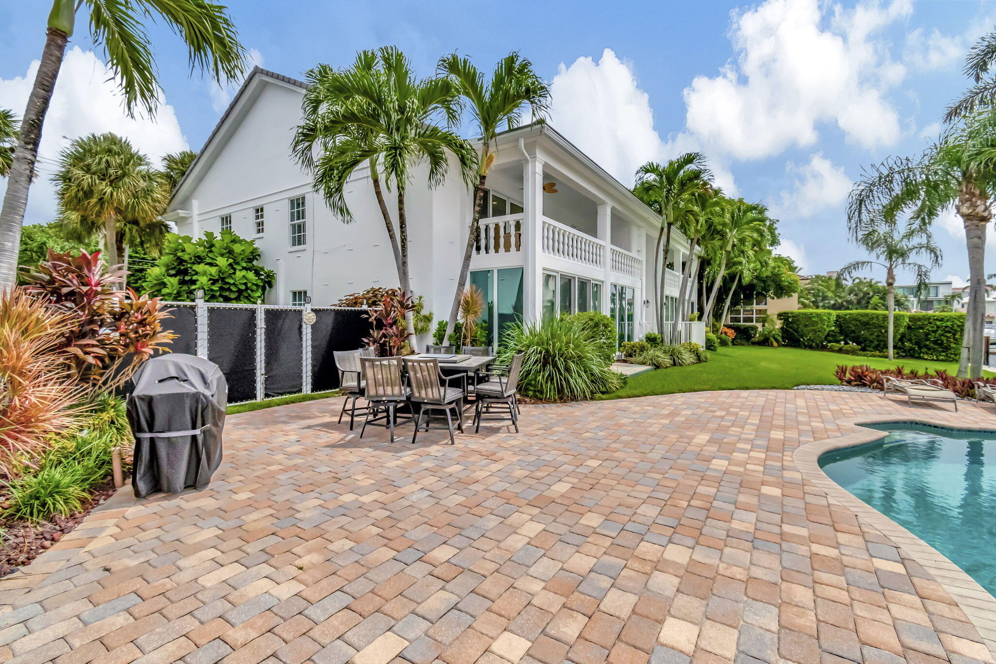 1710 South Ocean Boulevard, Unit 32 Delray Beach, FL 33483 - Photo 41 of 58 a view of a patio with a table and chairs in patio