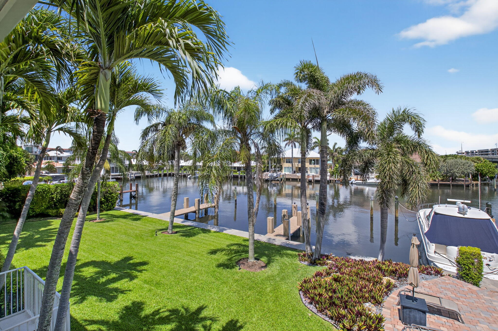 1710 South Ocean Boulevard, Unit 32 Delray Beach, FL 33483 - Photo 45 of 58 a backyard of a house with a garden and outdoor seating