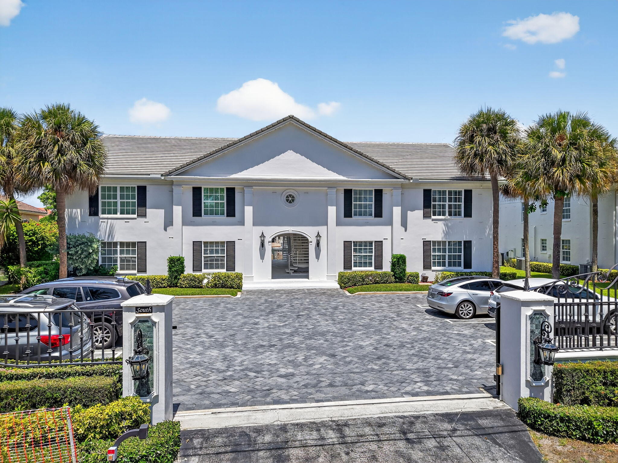 1710 South Ocean Boulevard, Unit 32 Delray Beach, FL 33483 - Photo 57 of 58 a front view of house with yard and seating area