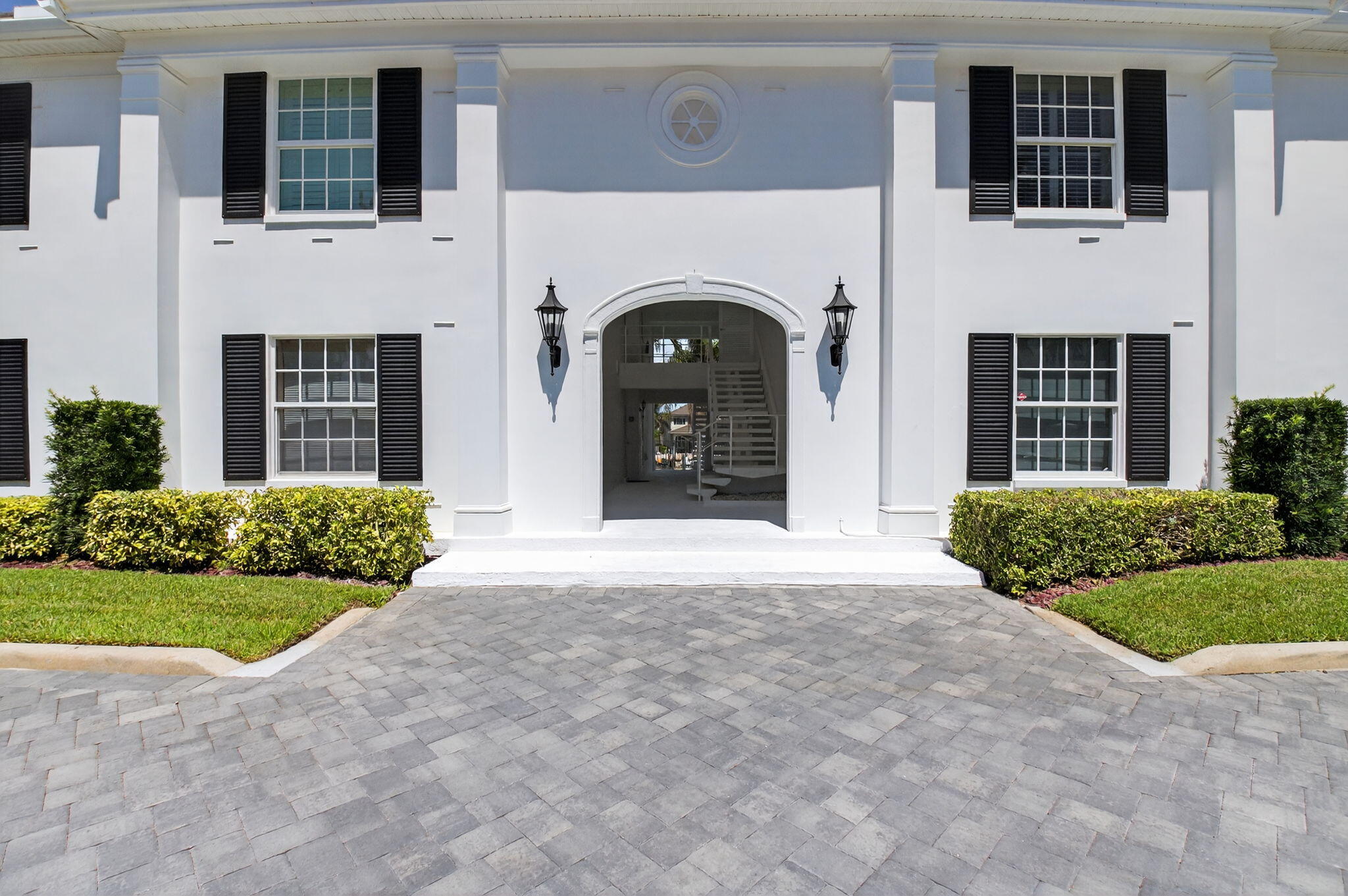 1710 South Ocean Boulevard, Unit 32 Delray Beach, FL 33483 - Photo 58 of 58 a front view of a house with garden