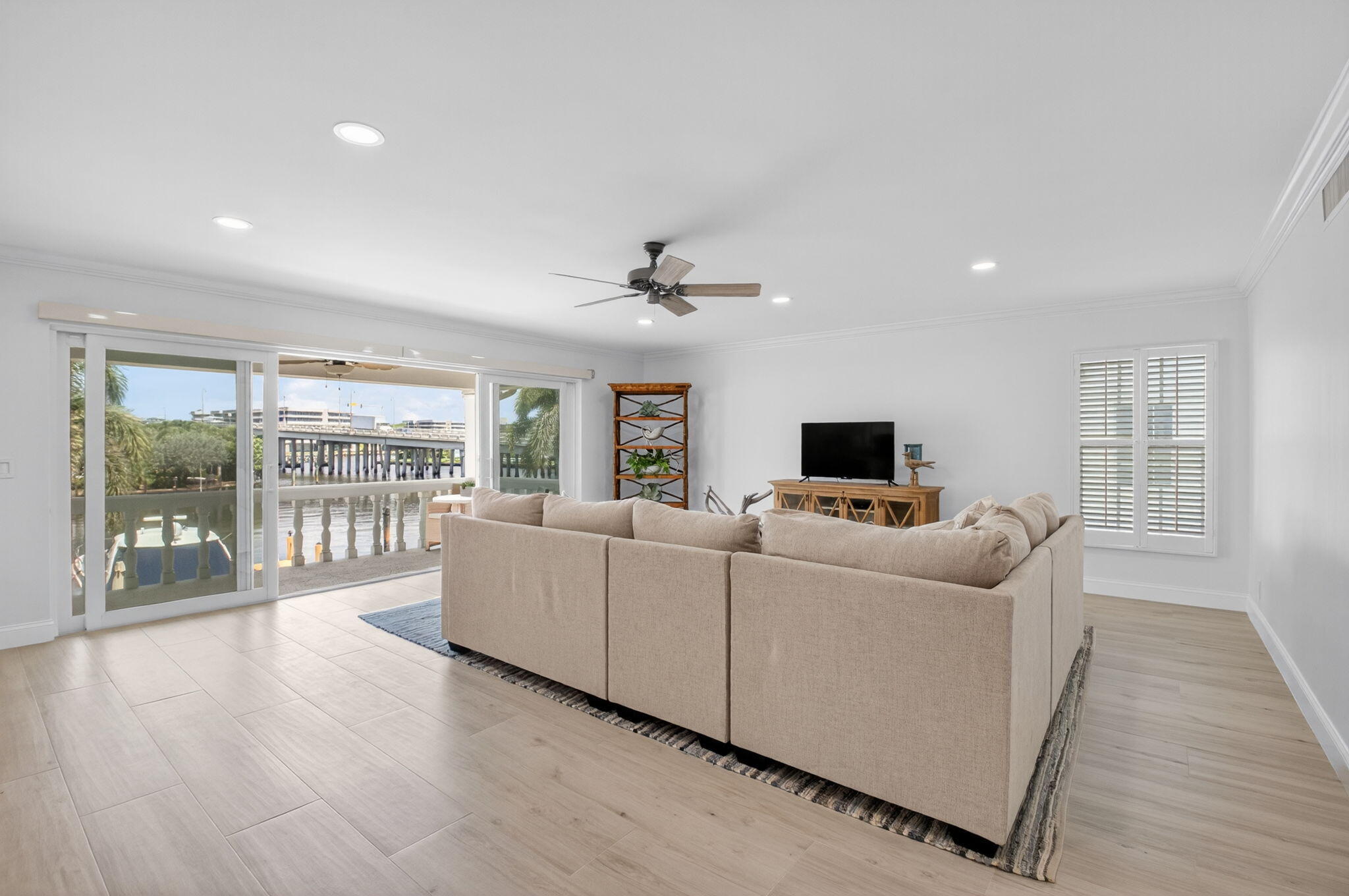 1710 South Ocean Boulevard, Unit 32 Delray Beach, FL 33483 - Photo 6 of 58 a living room with furniture and a flat screen tv