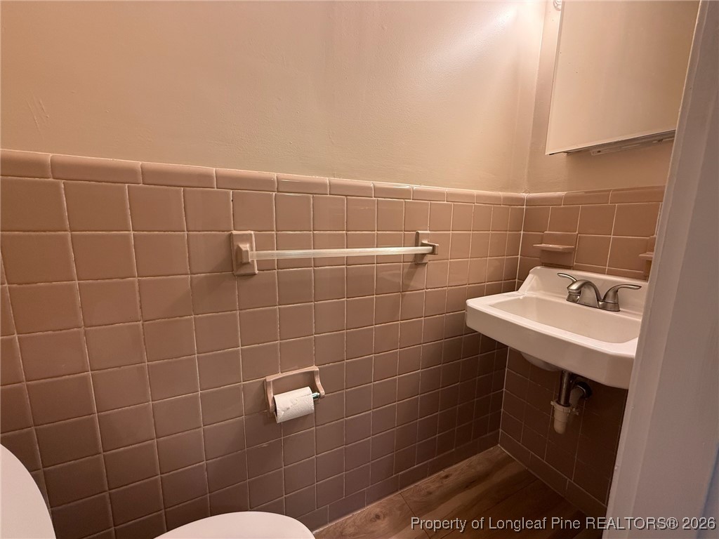 161 Fowler Lane Dunn, NC 28334 - Photo 11 of 12 a bathroom with a sink toilet and shower