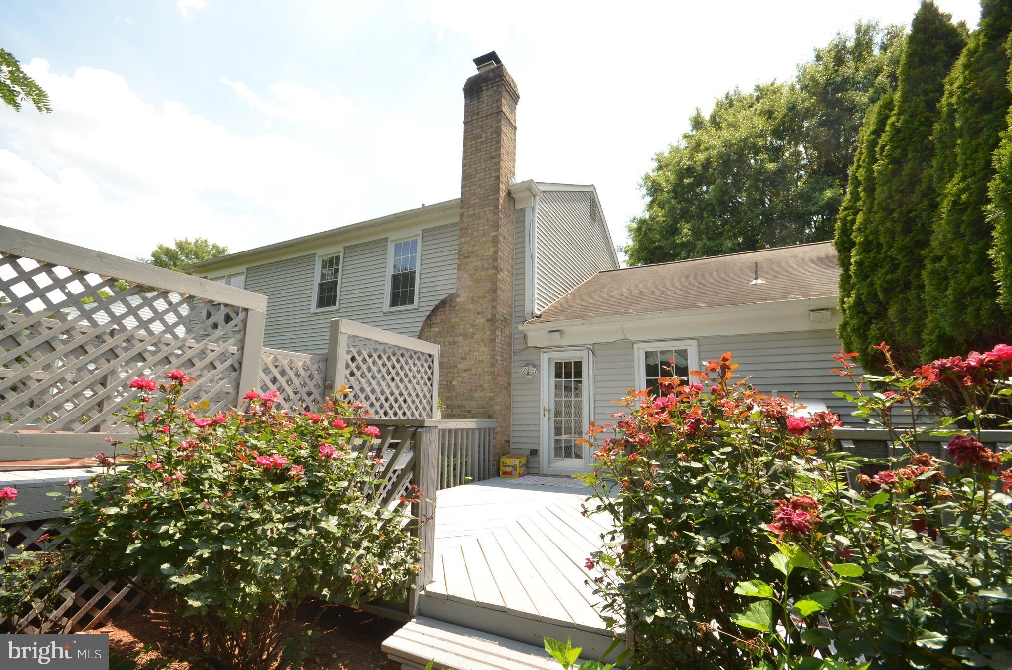 114 Hamilton Road Sterling, VA 20165 - Photo 22 of 27 Two tiered deck with a hot-tub behind the house