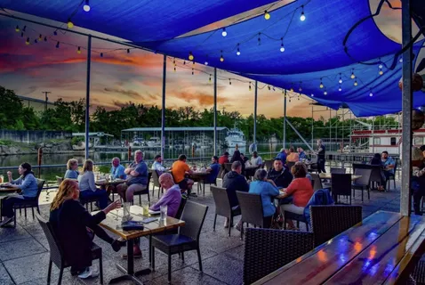 a group of people sitting outside of a city