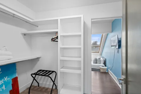 a bedroom with a bed and window