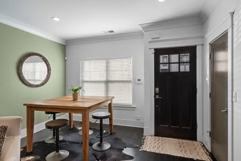 a view of a room that has a table and chair