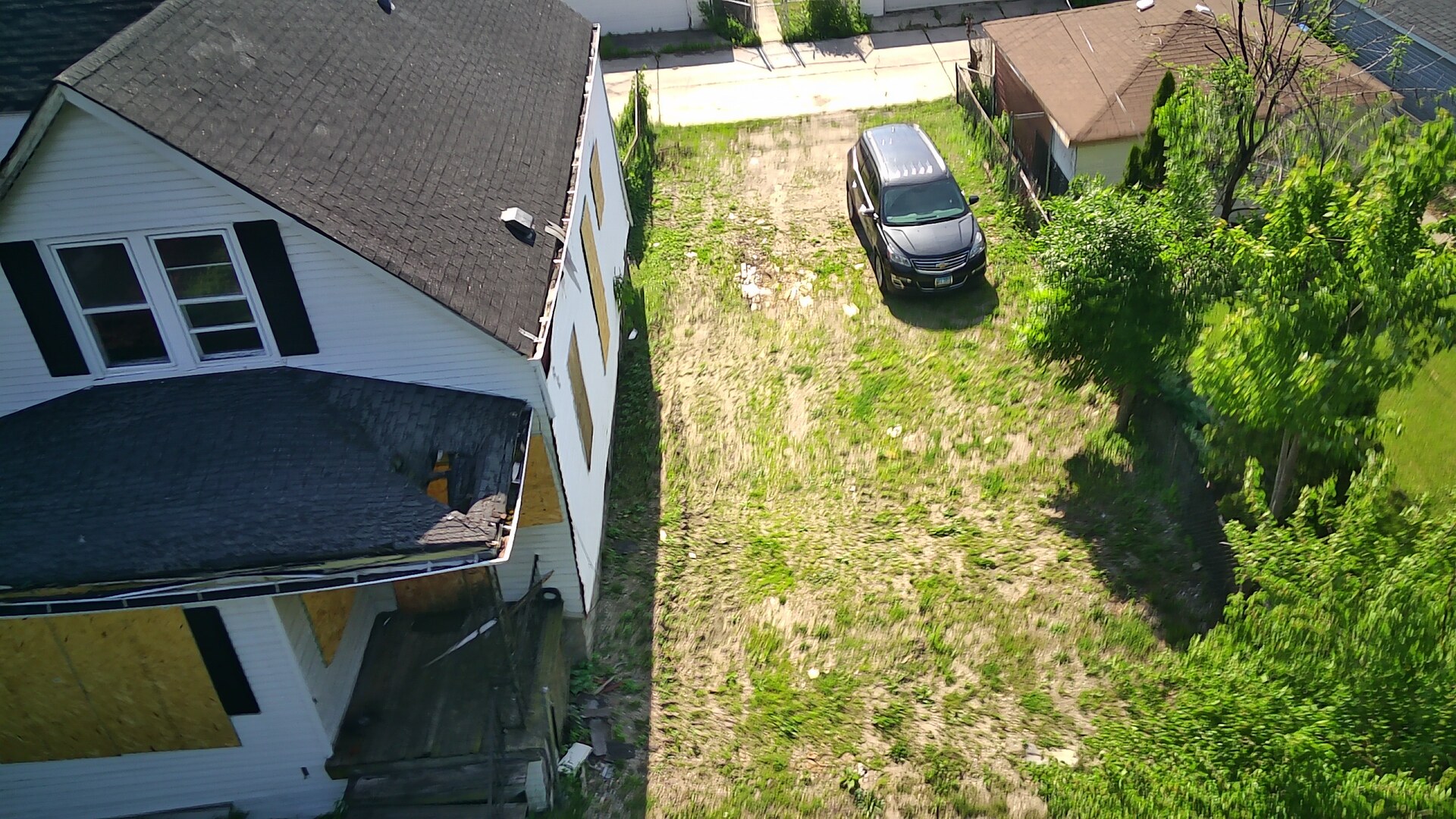 7736 South Indiana Avenue Chicago, IL 60619 - Photo 6 of 7 an aerial view of a residential houses with yard