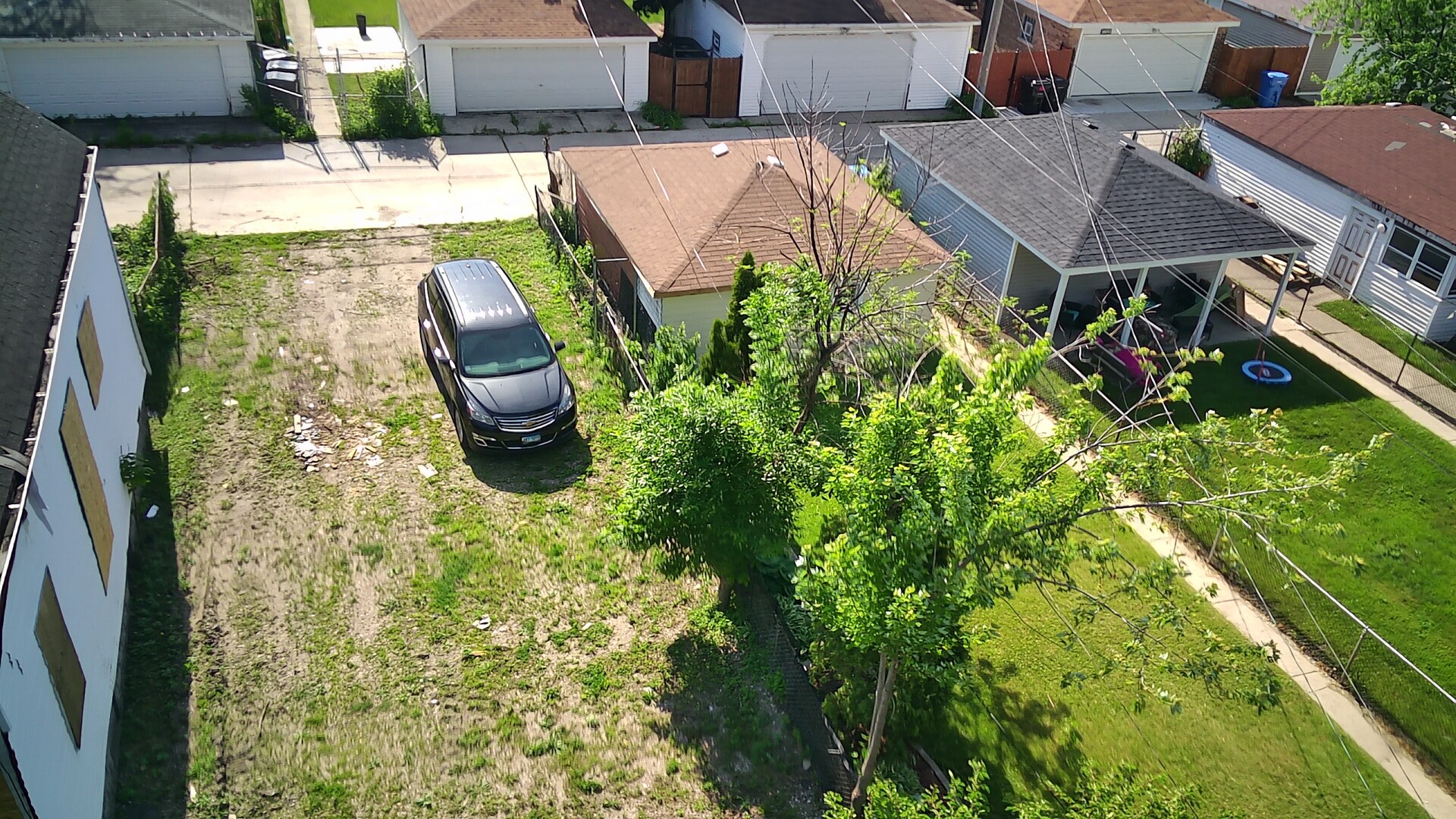 7736 South Indiana Avenue Chicago, IL 60619 - Photo 7 of 7 an aerial view of a house with garden space and sitting space