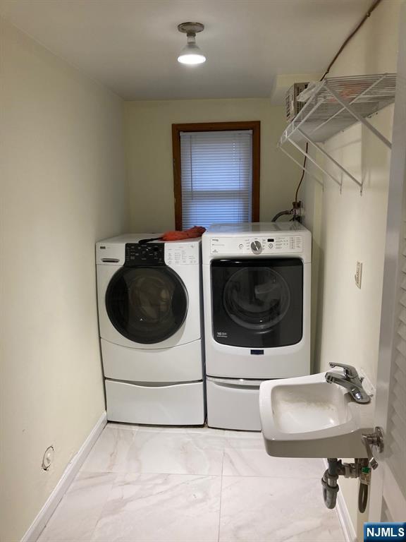 718 Spring Avenue Ridgewood, NJ 07450 - Photo 18 of 20 a utility room with dryer and washer