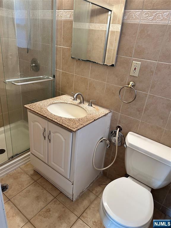 718 Spring Avenue Ridgewood, NJ 07450 - Photo 19 of 20 a white toilet sitting next to a bathroom sink