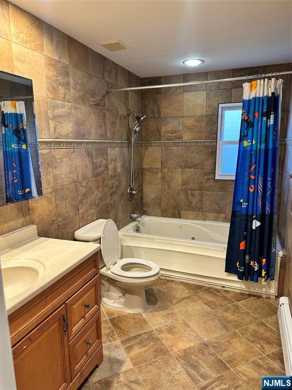 718 Spring Avenue Ridgewood, NJ 07450 - Photo 9 of 20 a bathroom with a sink a toilet and shower