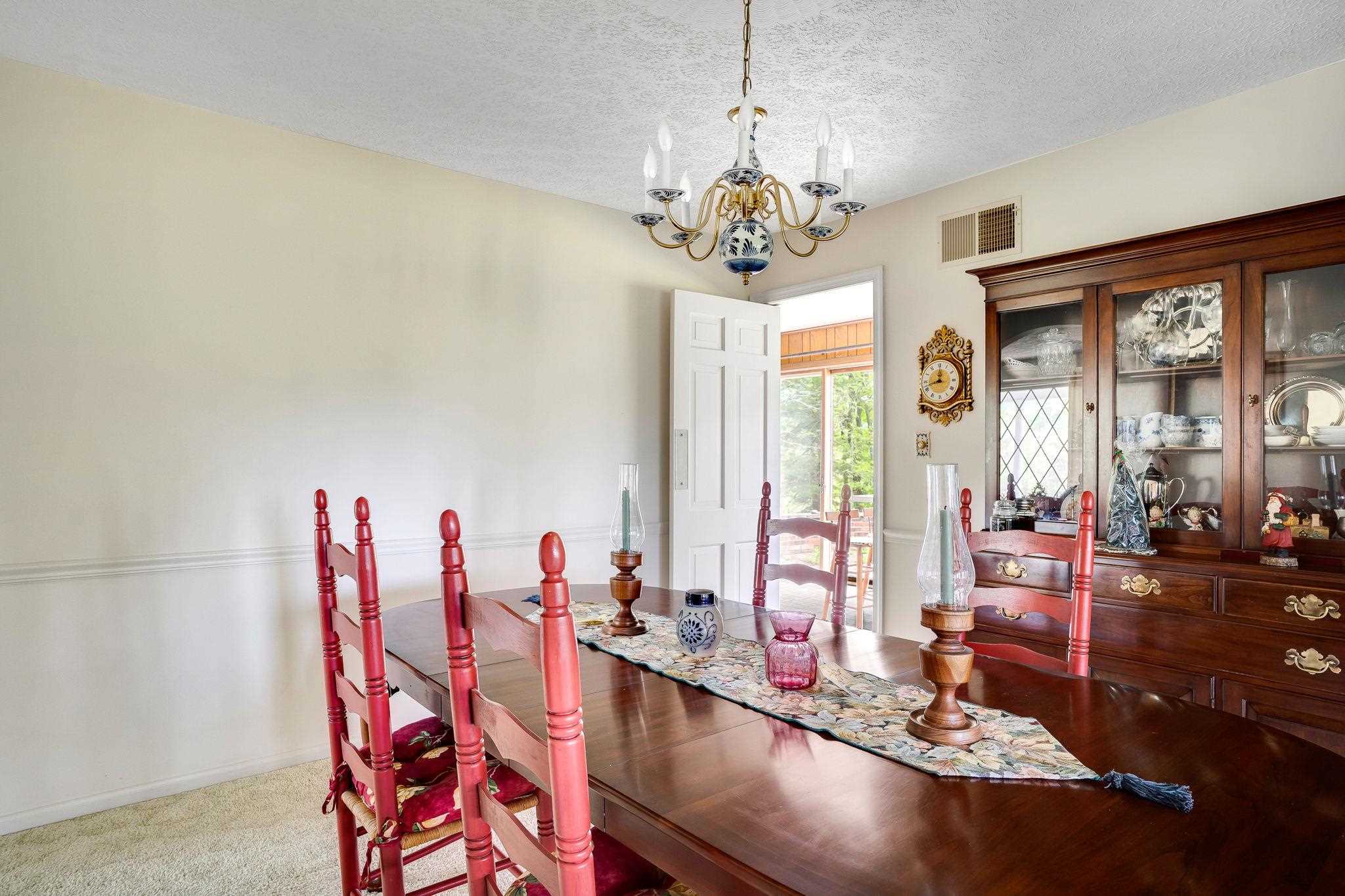 11590 Fort Valley Road Fort Valley, VA 22652 - Photo 15 of 40 a view of a dining room with furniture wooden floor and chandelier