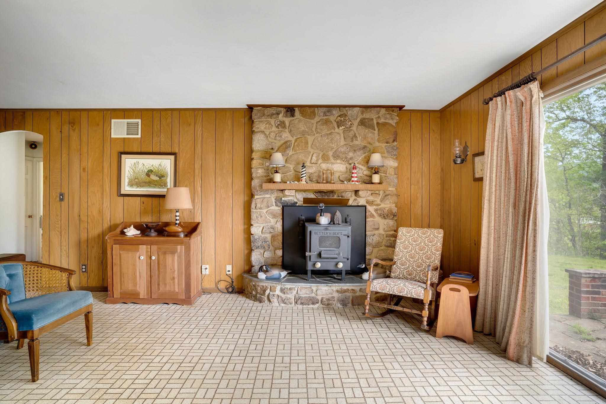 11590 Fort Valley Road Fort Valley, VA 22652 - Photo 21 of 40 a living room with furniture and a fireplace