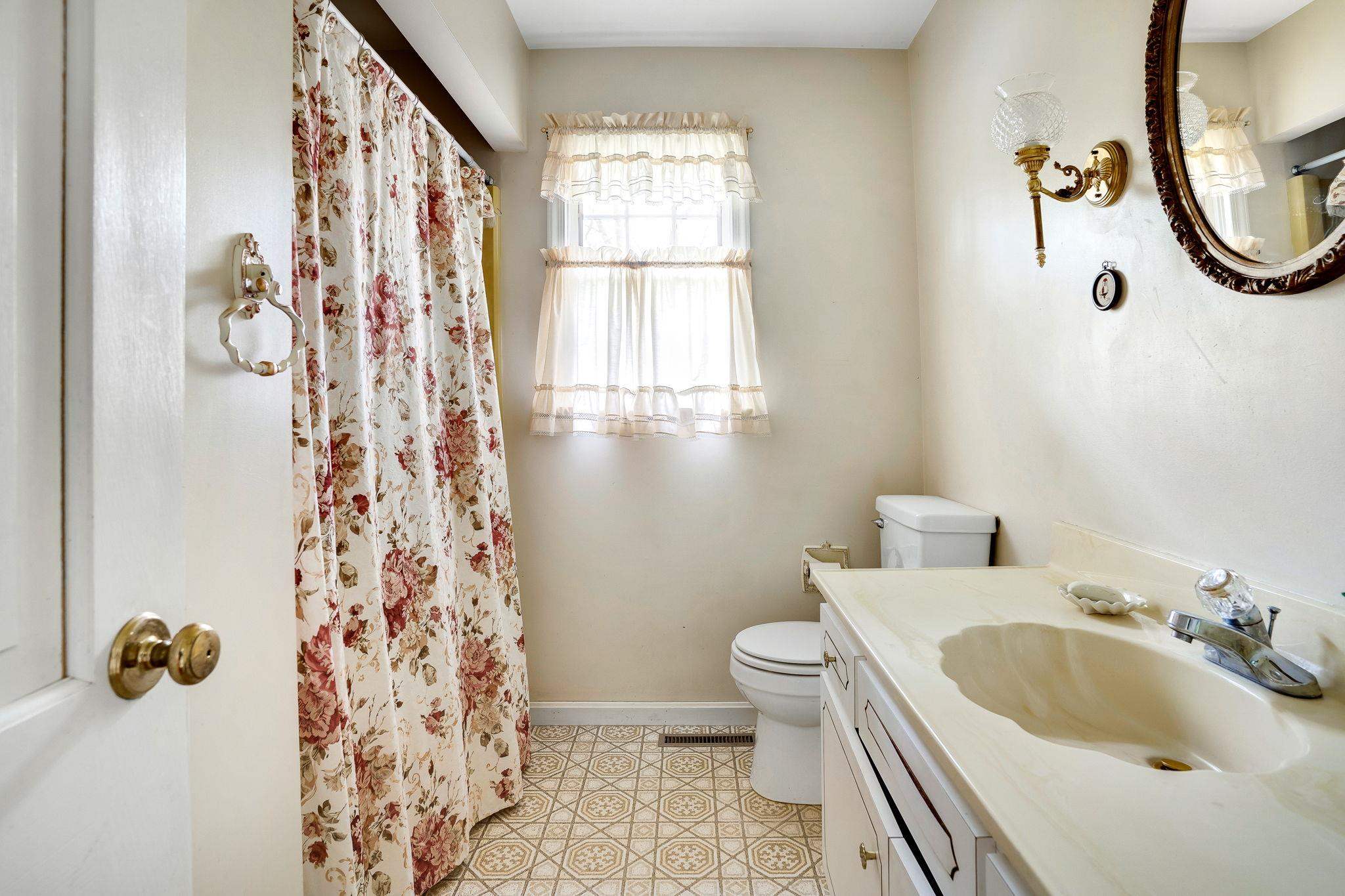 11590 Fort Valley Road Fort Valley, VA 22652 - Photo 28 of 40 a bathroom with a sink and a mirror