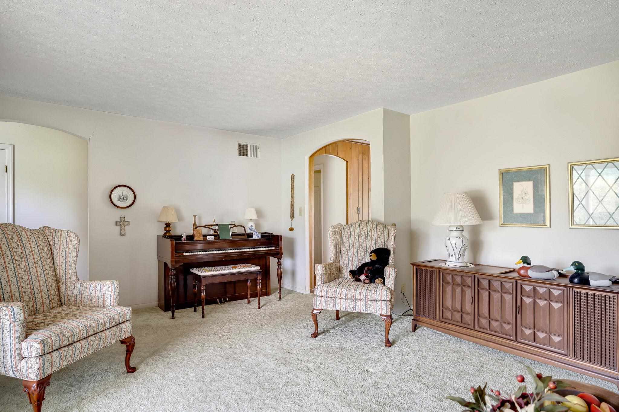 11590 Fort Valley Road Fort Valley, VA 22652 - Photo 9 of 40 a living room with furniture and a piano