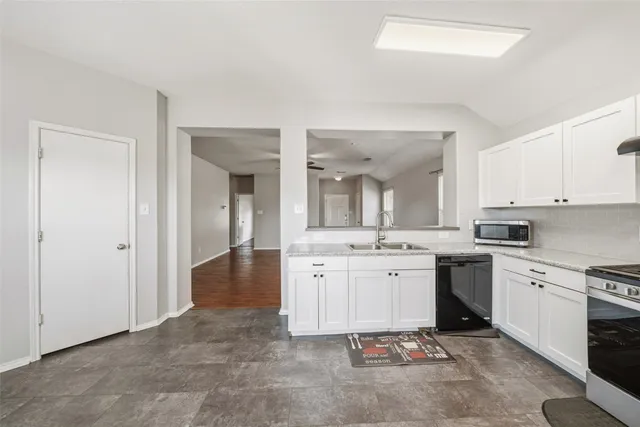 a large bathroom with a sink and a mirror