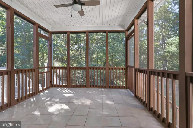 a view of a porch with wooden floor and outdoor space