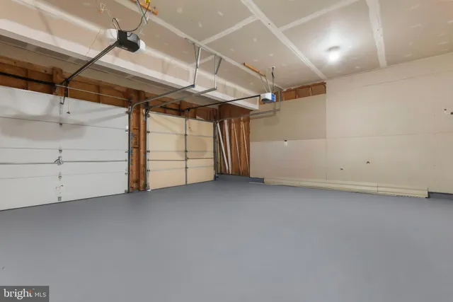 a view of backyard of house with green space