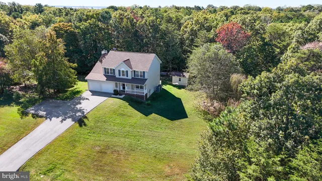 a view of outdoor space with green field and trees all around