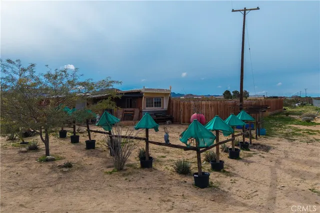 a view of a chairs and table in patio