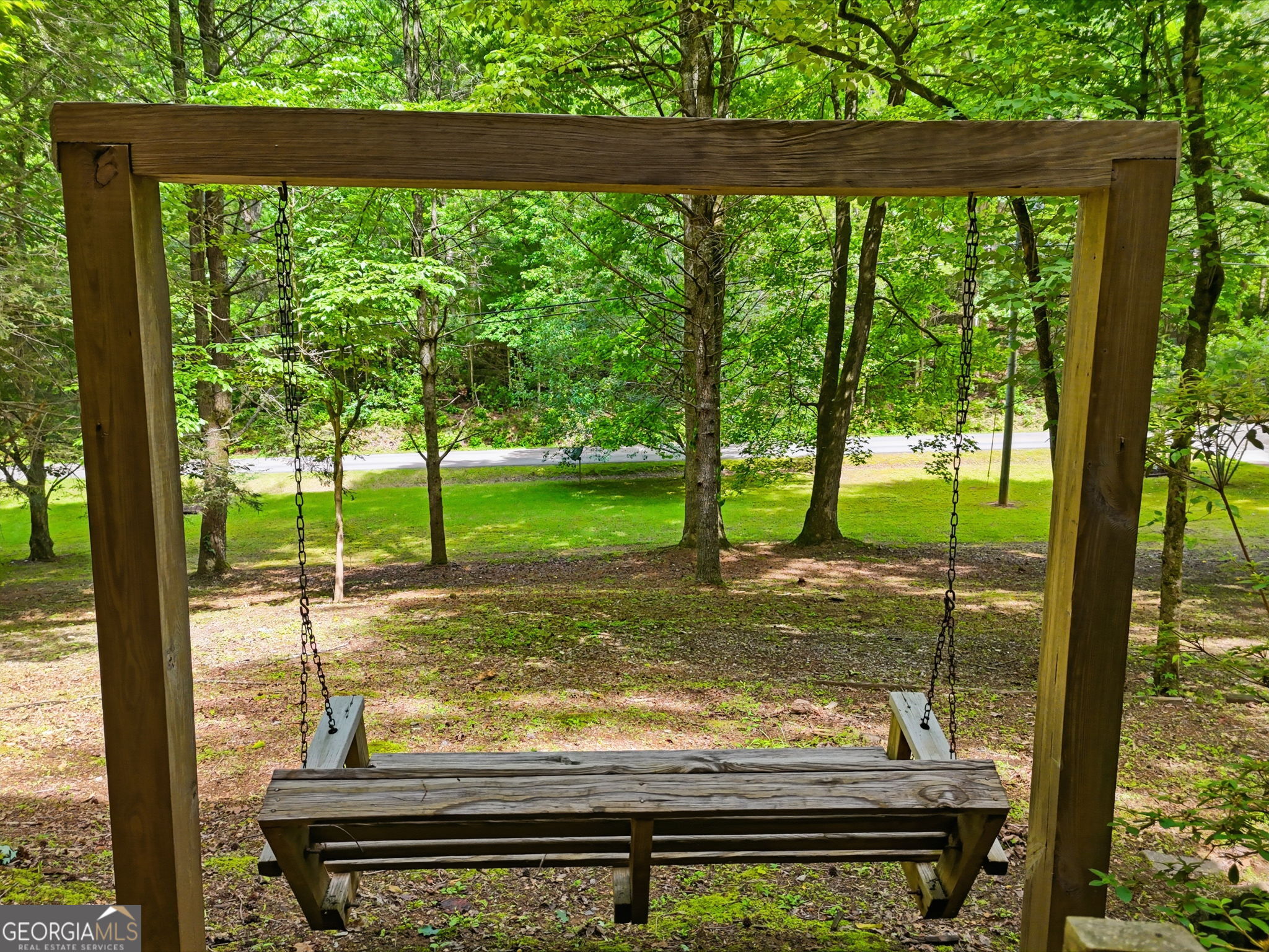 629 Goose Island Road Cherry Log, GA 30522 - Photo 43 of 52 a view of a yard with wooden floor and a floor to ceiling window