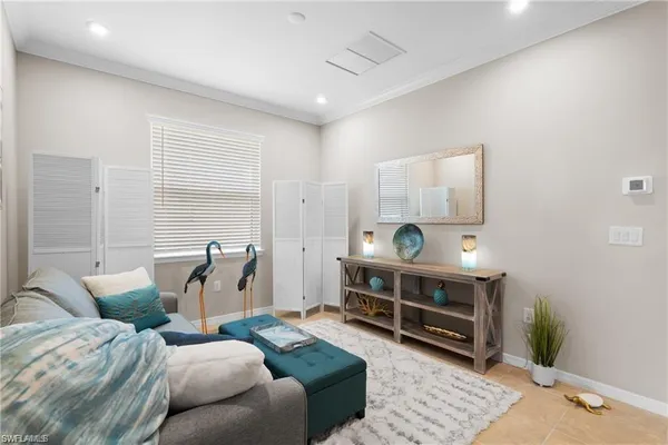 a living room with furniture a rug and a wooden floor
